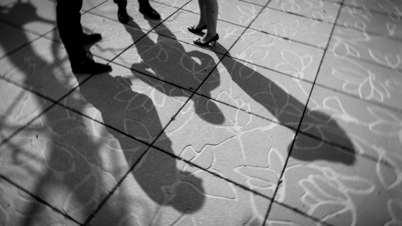 3 shadows on courtyard floor